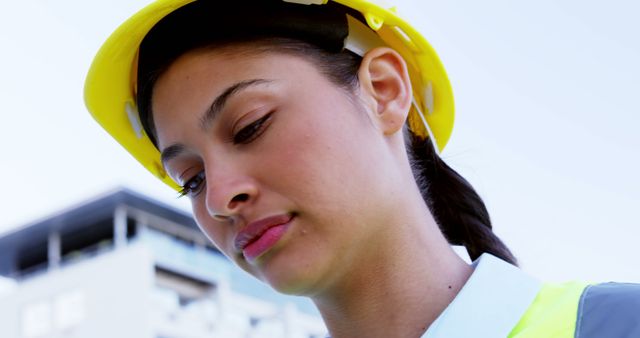 Portrait of biracial female architect in hard hat with copy space. Architecture, engineering, business, work and professionals concept, unaltered.