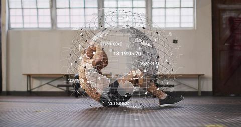 Fit man performing core workout on gym floor with holographic global network overlay