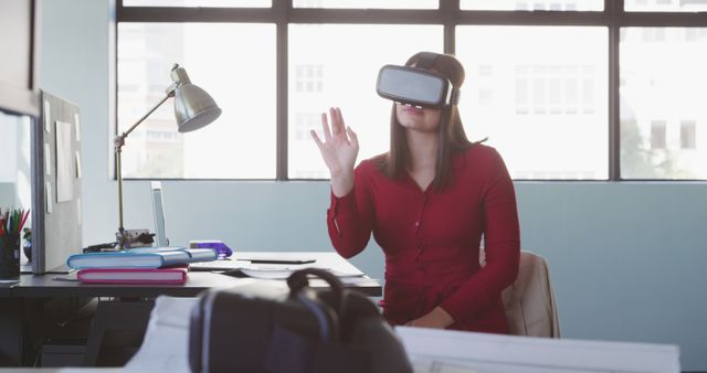 Woman Experiencing Virtual Reality Technology in Office Environment - Download Free Stock Images Pikwizard.com