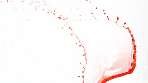 Dramatic Red Liquid Splashing on White Surface