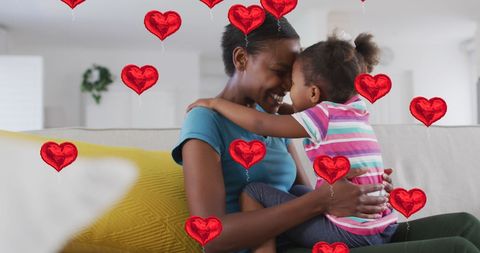 Mother and Daughter Bonding Surrounded by Hearts