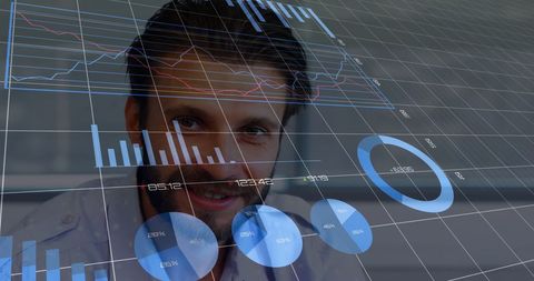 Businessman analyzing financial data with digital charts overlay