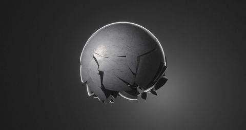 Cracked sphere disintegrating on grey background