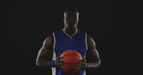 Athletic Basketball Player in Blue Uniform Holding Ball - Download Free Stock Images Pikwizard.com