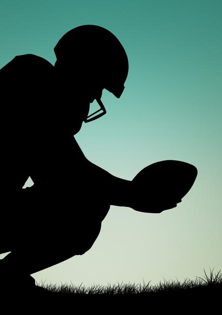 This image shows a silhouette of an athlete wearing a helmet and crouching while holding a rugby ball against a gradient blue sky. This minimalist yet powerful depiction captures the essence of preparation and focus in sports. Ideal for use in sports-themed marketing materials, inspirational posters, or articles about rugby.