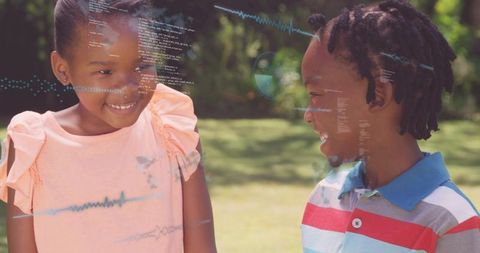 Playful children laughing in sunlit backyard with digital code and waveform overlays