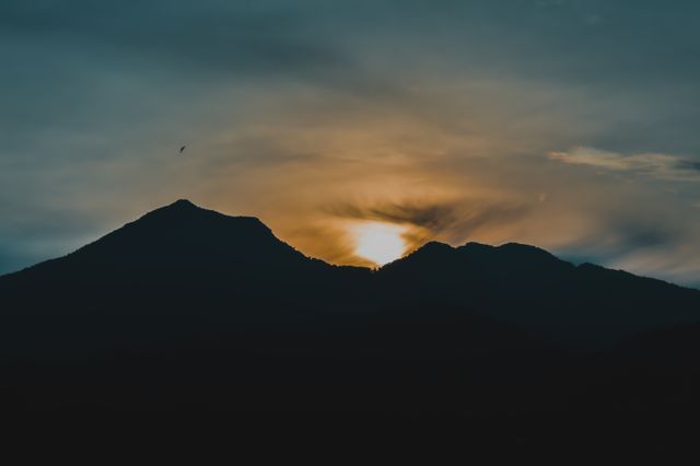 Serene Mountain Sunset with Bird Silhouette - Download Free Stock Photos Pikwizard.com