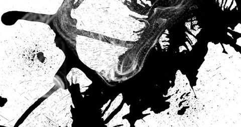 Dynamic abstract ink splatter on white canvas