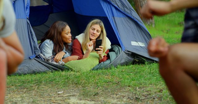 Friends Relaxing in Tent Using Smartphone in Outdoor Camp - Download Free Stock Images Pikwizard.com