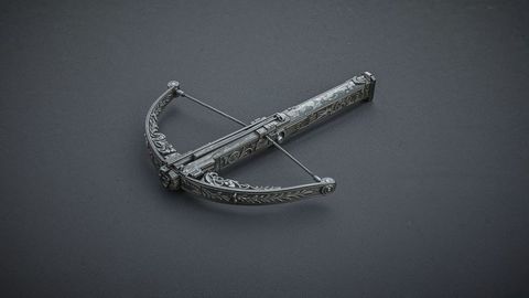 Ornate antique crossbow with engraved metal patterns