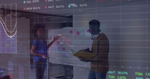 Colleagues Analyzing Financial Data and Stock Charts in Modern Office