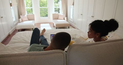 Relaxing Couple Enjoying Movie in Cozy Bedroom