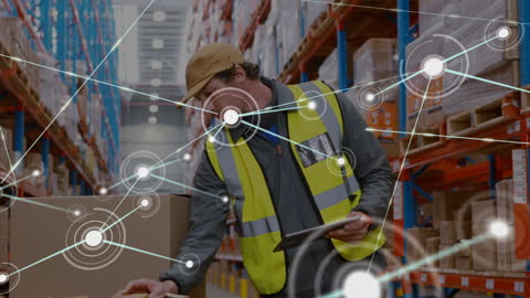 Logistics Worker Utilizing Technology in Modern Warehouse