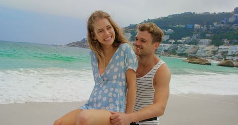 Couple Enjoying Romantic Beach Day on Bicycle