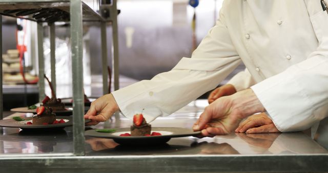 Chefs Arranging Plated Desserts In Restaurant Kitchen - Download Free Stock Images Pikwizard.com