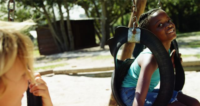 Children Playing on Tire Swings in a Park - Download Free Stock Images Pikwizard.com