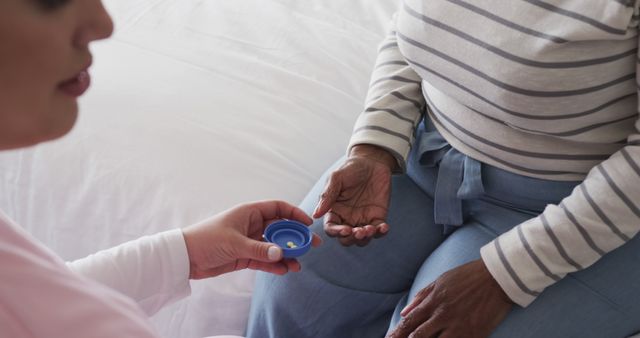 Senior Woman Receiving Medication from Caregiver at Home - Download Free Stock Images Pikwizard.com