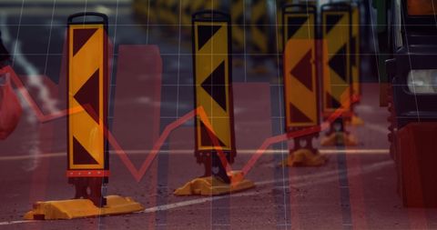 Traffic barriers with overlay of fluctuating stock market graph