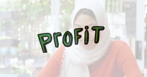 Focused Woman in Hijab Studying at Café Seeking Productivity