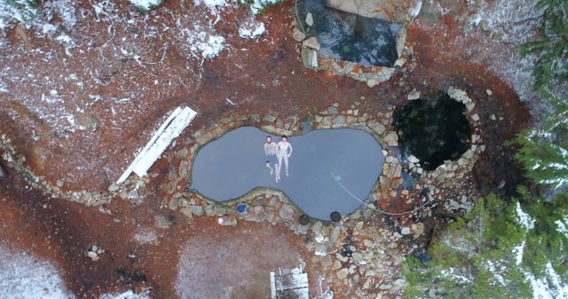 Aerial View of Three People Relaxing in Hot Springs Surrounded by Nature - Download Free Stock Photos Pikwizard.com