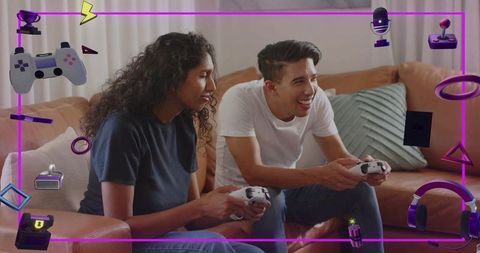 Couple playing video games on couch holding white controllers with purple gaming overlay