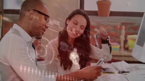 Coworkers Analyzing Sales Data with Futuristic Interface Overlay