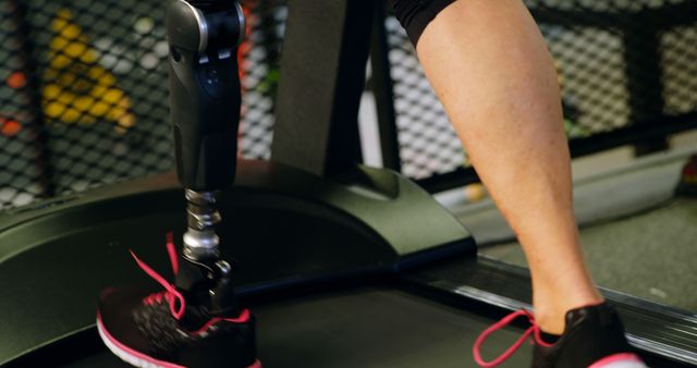 Athlete with Prosthetic Running on Treadmill at Gym - Download Free Stock Images Pikwizard.com