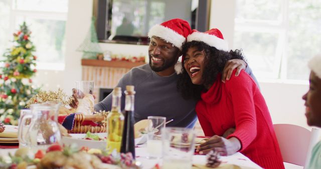 Joyful Family Celebrating Christmas Together Wearing Santa Hats - Download Free Stock Images Pikwizard.com