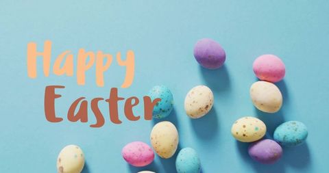 Colorful Easter Eggs and Happy Easter Message on Blue Background