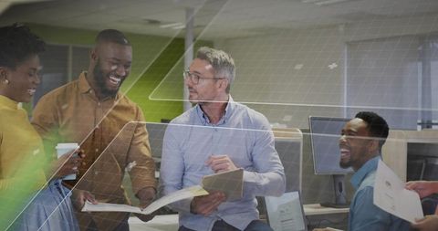 Diverse Team Collaborating in Modern Office Over Tablet