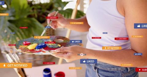Woman painting on patio holding palette and brush with social media engagement badges