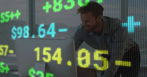 Financial analyst examining stock data with digital overlay