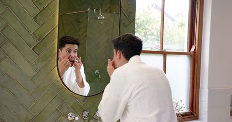 man skincare routine in modern bathroom mirror reflection - Download Free Stock Images Pikwizard.com