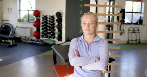 Confident Female Therapist in Rehabilitation Room Ambience