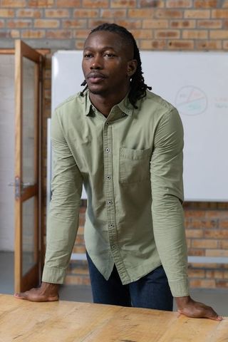 Confident professional leading meeting in modern conference room