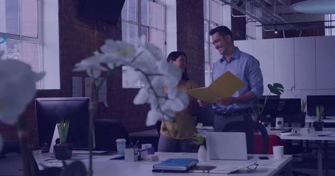 Business Professionals Collaborating in Open-Plan Workspace