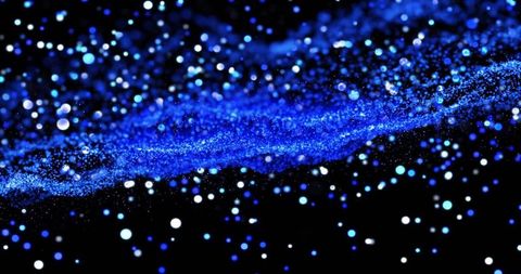 Abstract Blue Particles in Motion on Dark Background