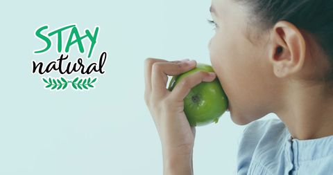Stay Natural: Girl Embracing Healthy Eating with Green Apple - Download Free Stock Images Pikwizard.com