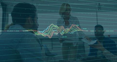 Senior presenter highlighting data analytics in modern office