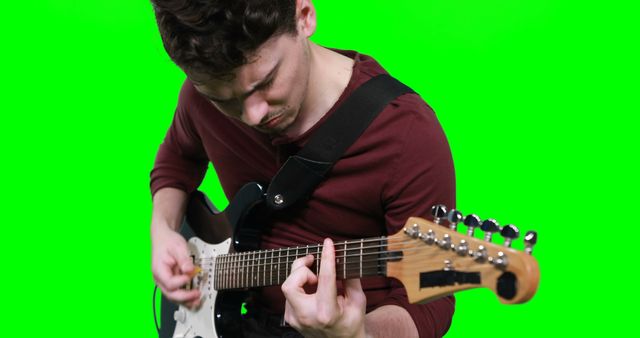 Young Man Playing Electric Guitar with Green Screen Background - Download Free Stock Images Pikwizard.com