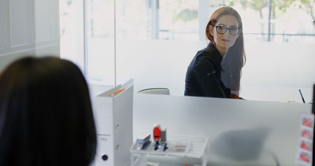 Business Woman Having Conversation in Office with Colleague - Download Free Stock Images Pikwizard.com