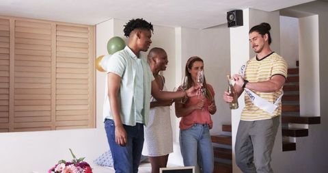 Friends Celebrating Together with Wine and Happiness at Home