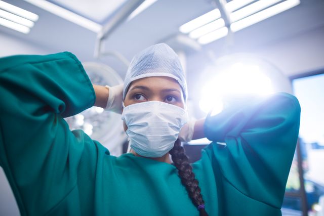 Surgeon wearing surgical mask in operation theater of hospital