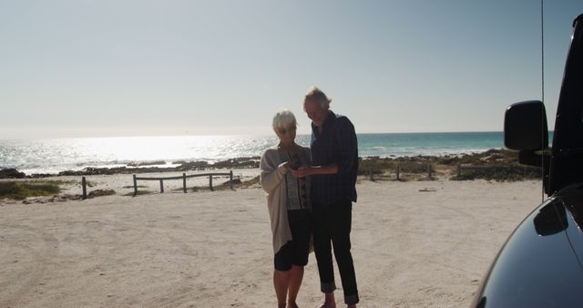 Senior Couple Enjoying Scenic Coastal View - Download Free Stock Images Pikwizard.com