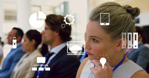 Businesswoman attending tech conference studying cloud, data and innovation icons