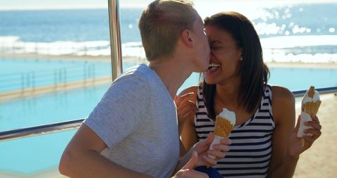 Cheerful Couple Enjoying Ice Cream by Sunny Seaside Pool - Download Free Stock Images Pikwizard.com