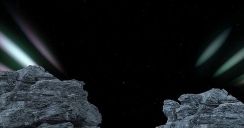 Aurora Lights over Rocky Landscape at Night