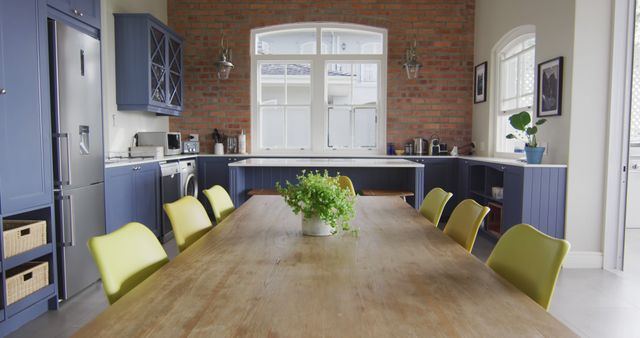 Interior of open plan kitchen and dining room with table and chairs. domestic lifestyle and interior design.