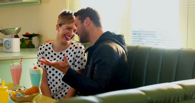 Happy Couple Laughing in Retro Diner with Milkshakes - Download Free Stock Images Pikwizard.com