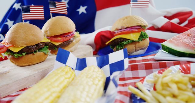 Close-up of hamburgers and french fries served on table with 4th july theme